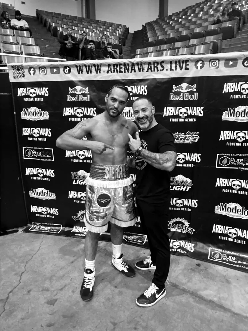 Jeremiah with his coach after the win at Arena Wars