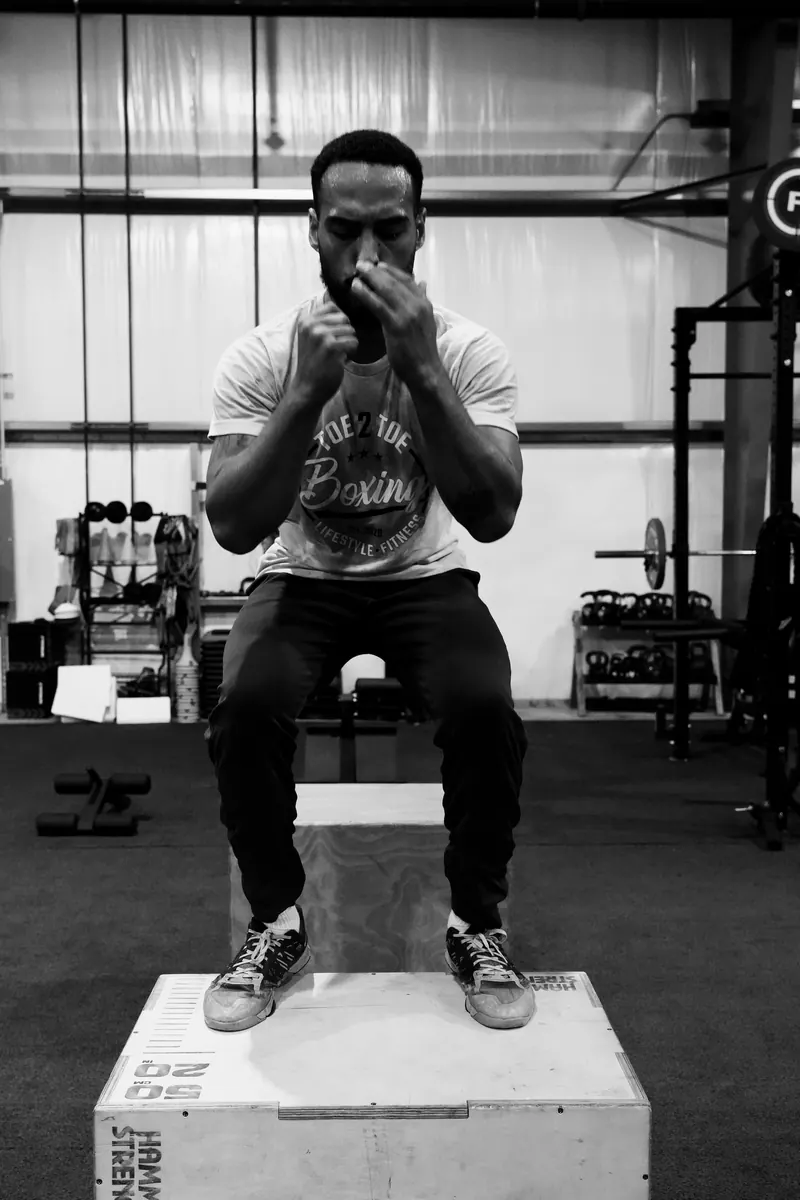 Jeremiah on a plyo box with his hands up in guard
