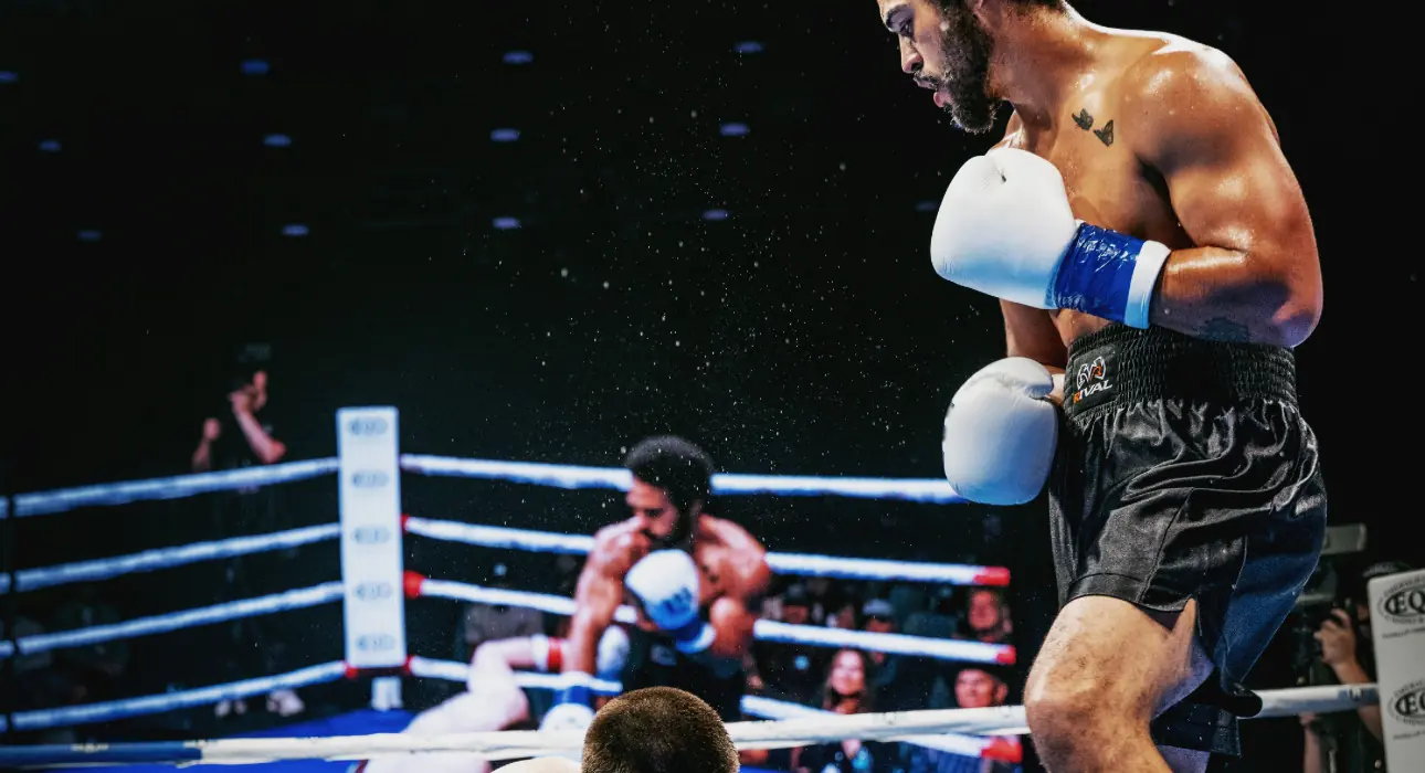 Jeremiah Sierra standing over a knocked-down opponent on fight night